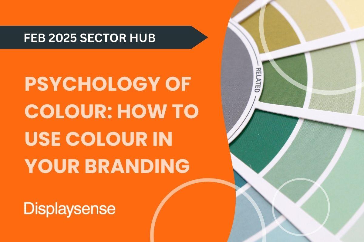 February 2025 Sector Hub by Displaysense exploring the psychology of colour in branding, featuring a fan deck of paint swatches in various green and neutral tones used for visual identity inspiration.