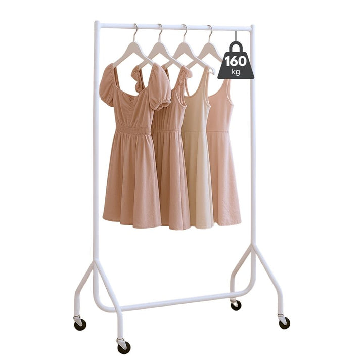 Four dresses on white hangers displayed on a 3ft white heavy duty clothes rail with locking castors, on a white background, 160kg badge visible.
