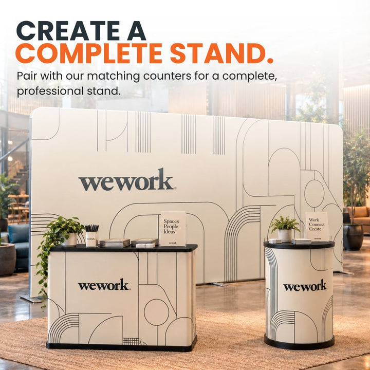 Large 5m printed fabric backdrop paired with matching branded exhibition counters to create a coordinated promotional stand.