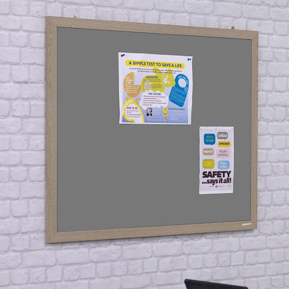 Eco-friendly grey felt noticeboard with a wood-effect frame, measuring 1200 x 900mm. Perfect for home or office organization.