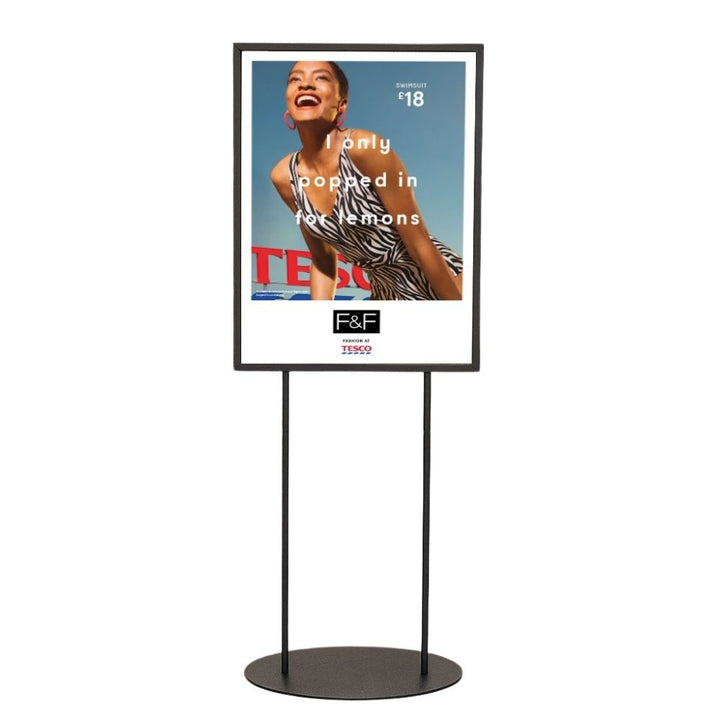 Front-facing cut-out of a black A1 double-sided poster display stand with twin legs and oval aluminium base plate, on a white background.
