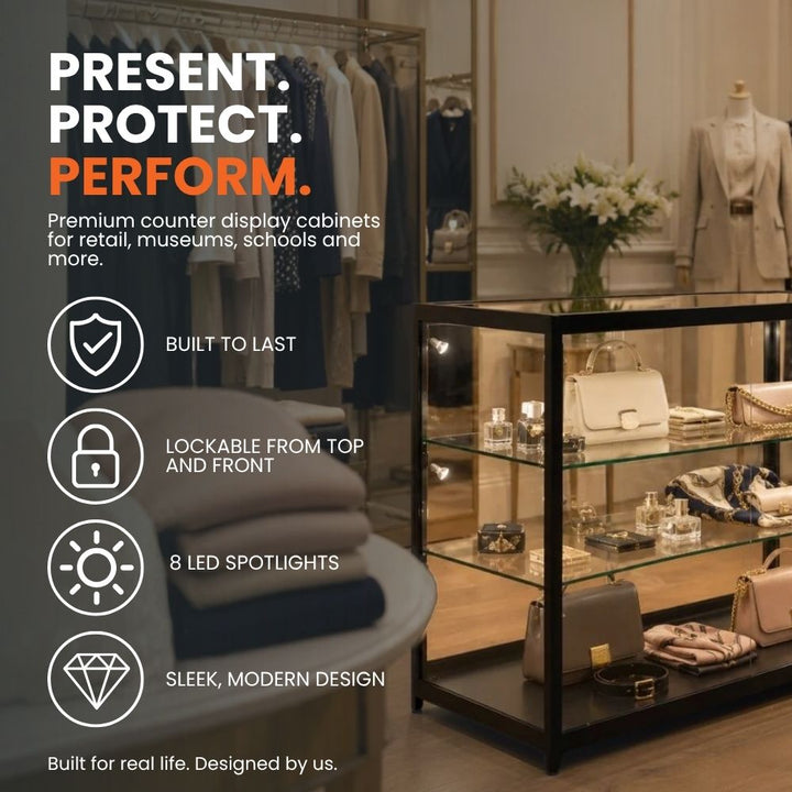 Black aluminium glass counter display cabinet in a retail setting, highlighting lockable access, eight LED spotlights, durable construction and a modern design.