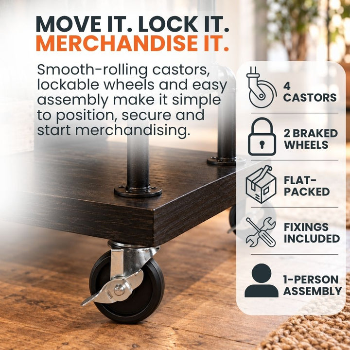 Close-up of a braked castor beneath the black wood-effect base of the mobile clothes rail, highlighting four castors, two locking wheels and flat-packed assembly.