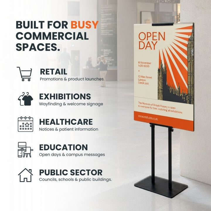 Black freestanding adjustable poster display stand for retail, exhibitions, healthcare, education and public sector signage.