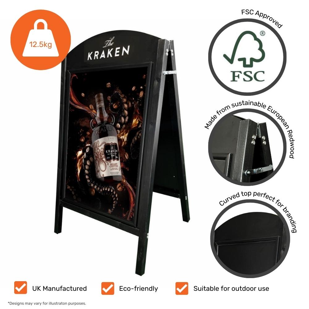 A high-quality black wooden A1 A-board sign with a curved top, featuring a chalkboard for handwritten messages and a snap frame for printed posters.
