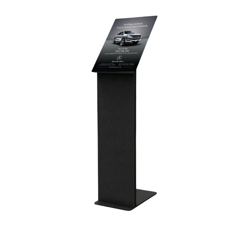 Black freestanding A3 display stand with frameless angled acrylic panel and solid steel base, shown on a white background.
