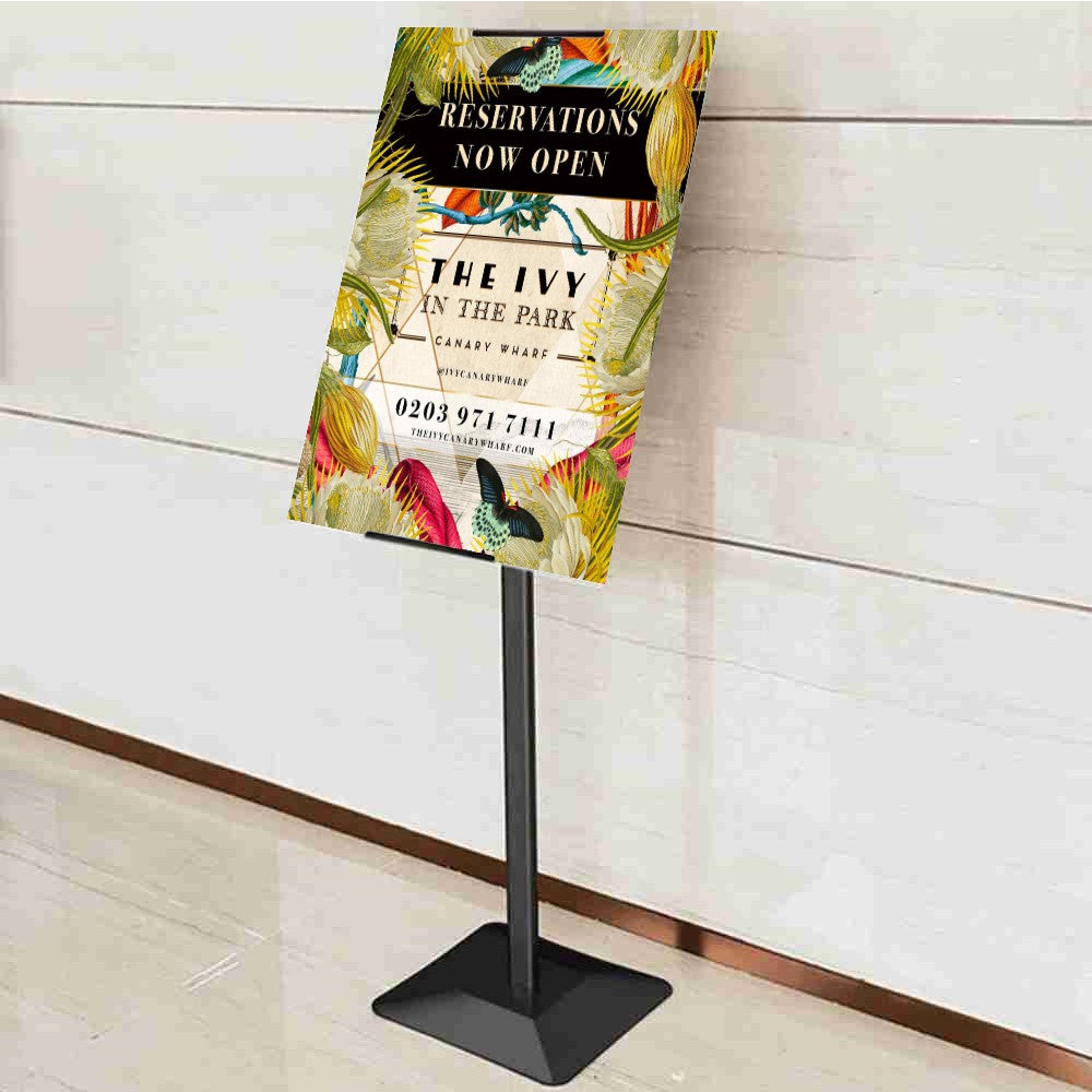 A black heavy-duty freestanding sign holder with adjustable height and 360-degree poster rotation, perfect for versatile and professional signage displays in retail and exhibitions.
