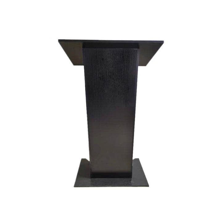 Front-on cut-out of a black wooden lectern showing the angled reading panel and wood-grain texture on the column, on a white background.
