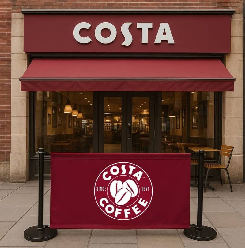 Heavy-duty black steel café barrier with a 1.5m printed double-sided banner, designed for cafés, restaurants, and retail spaces.
