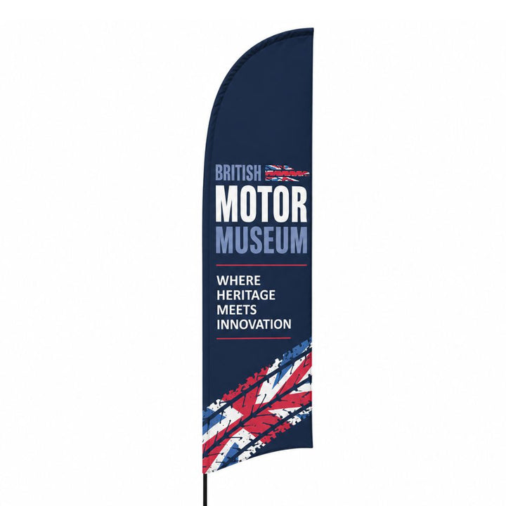 Navy blue British Motor Museum feather flag with Union Jack graphic and heritage meets innovation slogan for automotive events and museum branding.