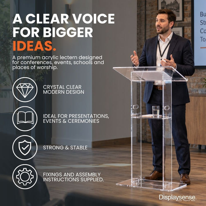 Clear acrylic lectern being used for a presentation, featuring a modern transparent design, stable base and integrated shelf for conferences, events, schools and ceremonies.