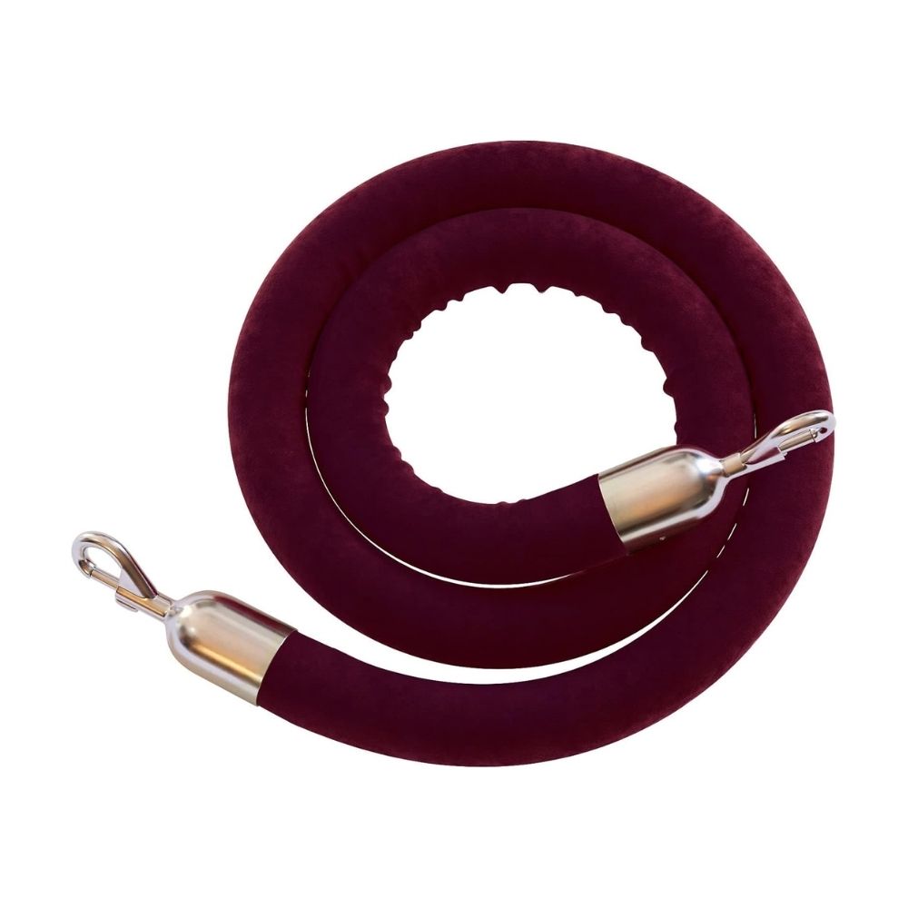 Coiled burgundy velvet rope featuring chrome snap clip ends, designed for premium stanchions and elegant event entrances.