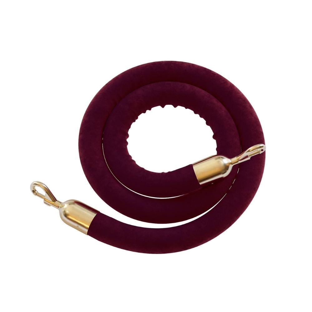 Coiled burgundy velvet rope featuring gold snap clip ends, designed for premium stanchion barriers and event crowd control.