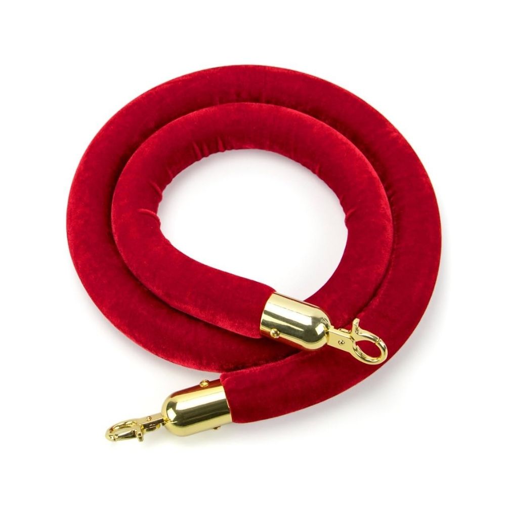 Coiled 1.2m red velvet barrier rope with polished brass fittings, ideal for stanchions at hotels, theatres, and special occasions.