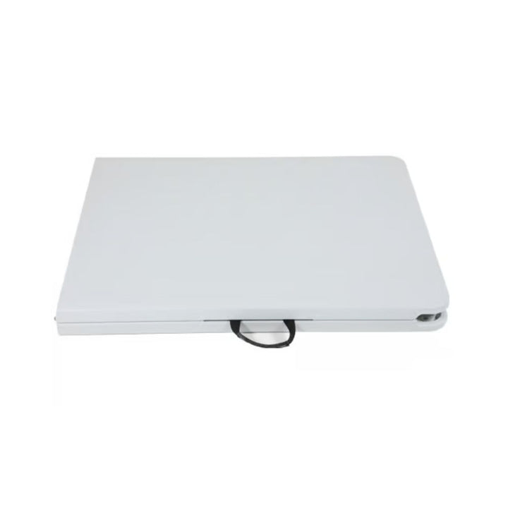 Portable white folding table folded flat with built-in carry handle for easy transport and storage.