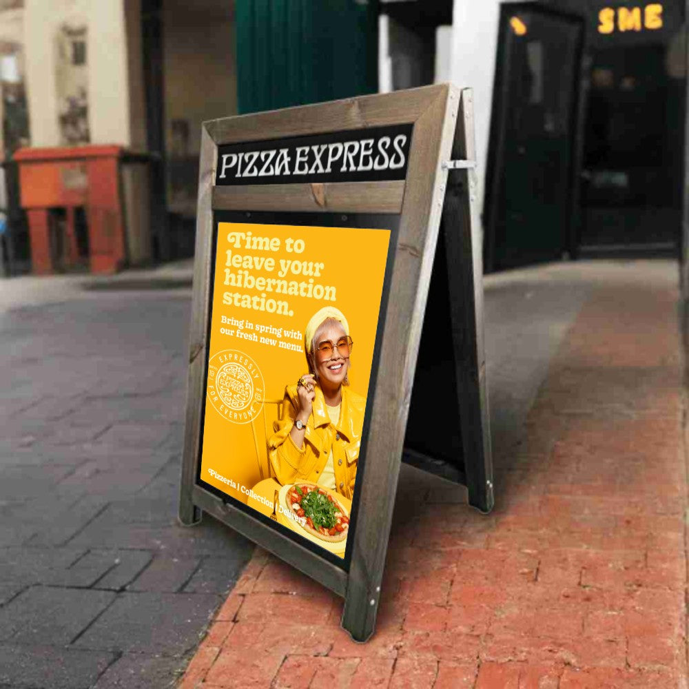 A stylish dark oak wooden A1 A-board pavement sign with a header, perfect for displaying menus, promotions, and branding in cafés, restaurants, and retail spaces.
