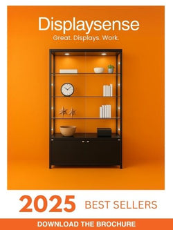 Front cover of Displaysense 2025 best sellers catalogue, showing a black display cabinet with decorative items against an orange wall.

