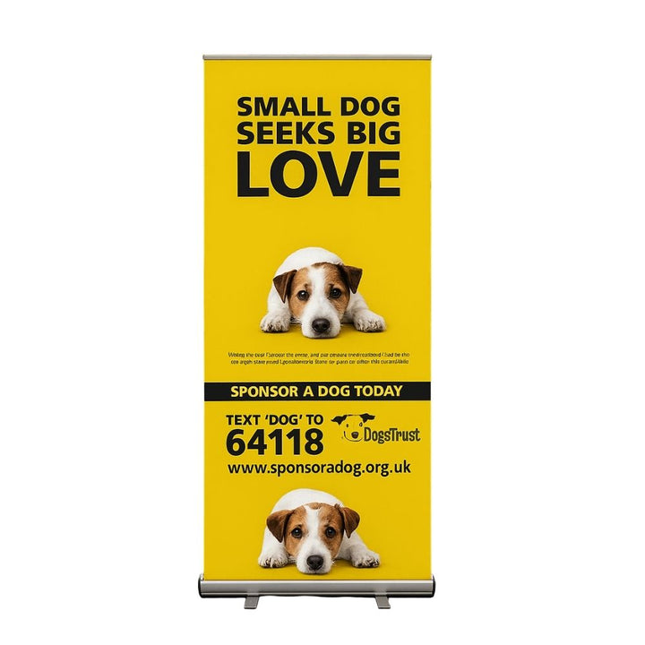 Freestanding yellow roll up banner with Jack Russell images and bold text promoting dog sponsorship via Dogs Trust, including text-to-donate details.

