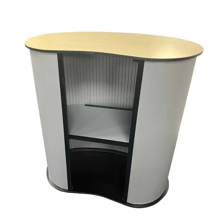 Rear of the counter opened up, two internal shelves set between the curved end panels below the natural wood face of the reversible top.
