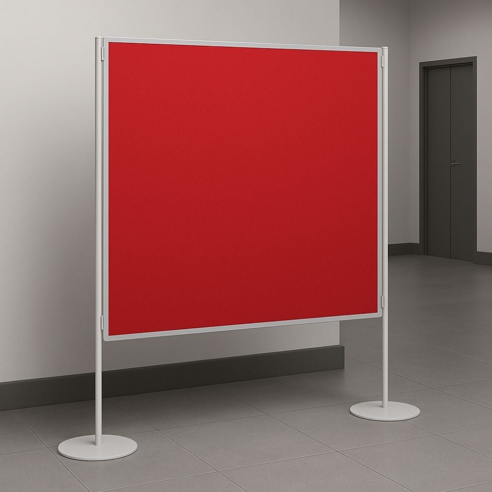 Freestanding red felt noticeboard with a white frame and circular bases, positioned in a clean, modern hallway with grey tiled flooring and closed office doors.

