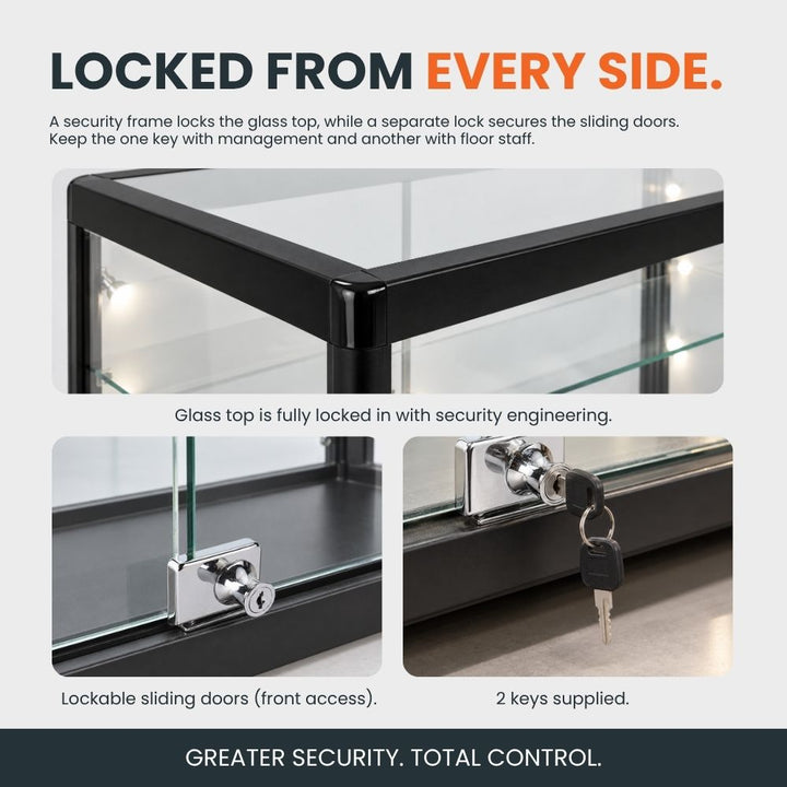 Close-up of a black glass counter display cabinet showing its secure glass top, lockable sliding doors and supplied keys for controlled access.