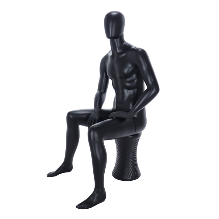Sleek matt black male mannequin in a seated pose, featuring an egghead design and stool for modern merchandising.
