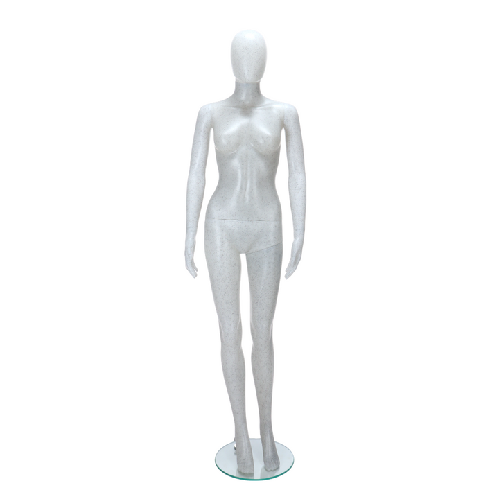 Contemporary standing female mannequin in matt white with black flecks, featuring an egghead design for stylish merchandising.
