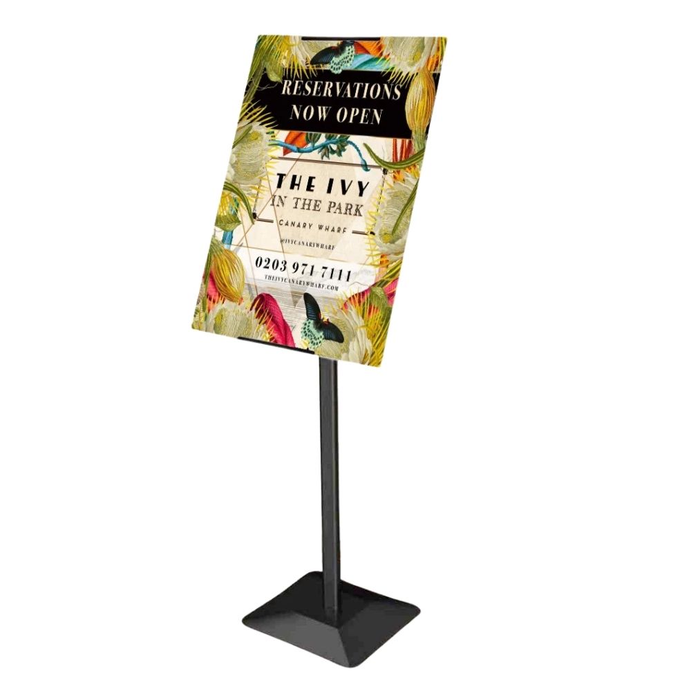 This durable black freestanding sign holder features a fully adjustable frame with 360-degree poster rotation, allowing for flexible and dynamic presentation options.

