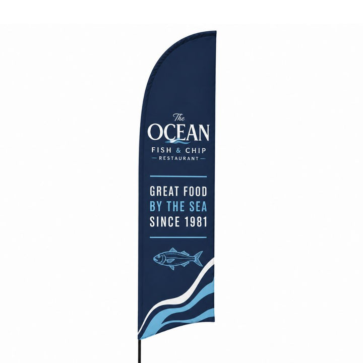 Navy blue feather banner for The Ocean Fish and Chip Restaurant featuring seaside graphics, seafood branding and great food by the sea promotional message.