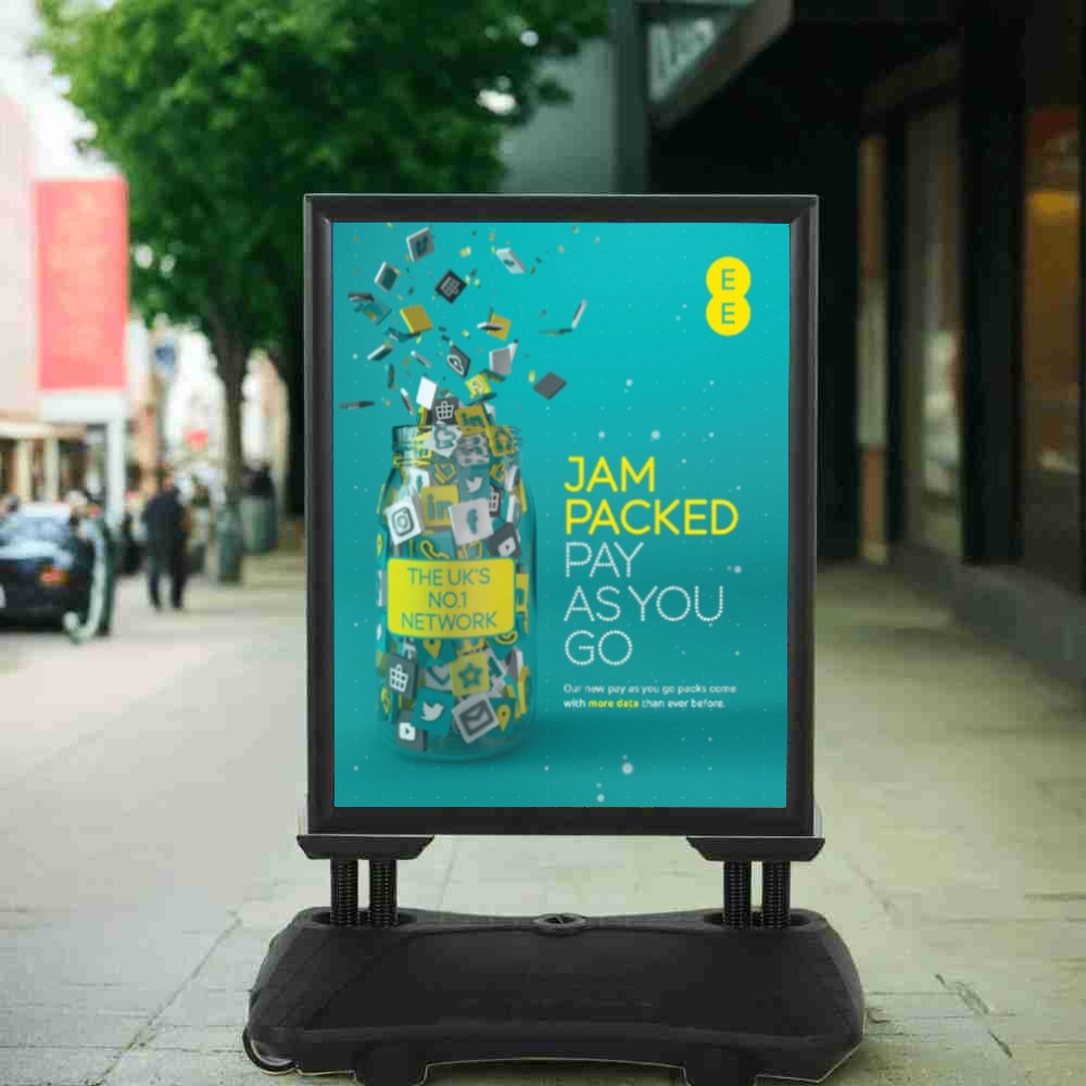 A premium black heavy-duty pavement sign with a water-filled base, offering superior stability and weather resistance, ideal for outdoor advertising and promotions.
