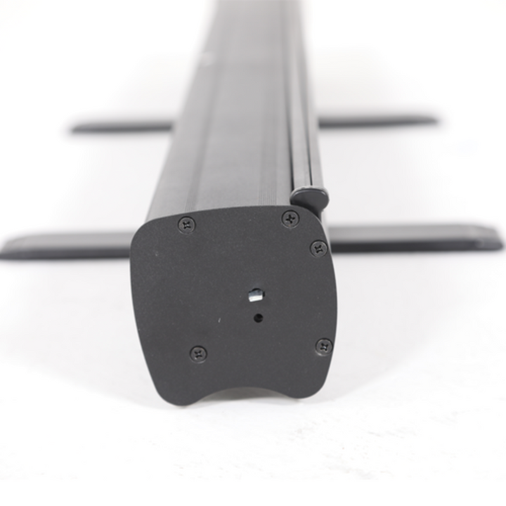 Close view of the retractable cassette housing with its fold-out stabilising feet extended, the mechanism the banner graphic winds into.
