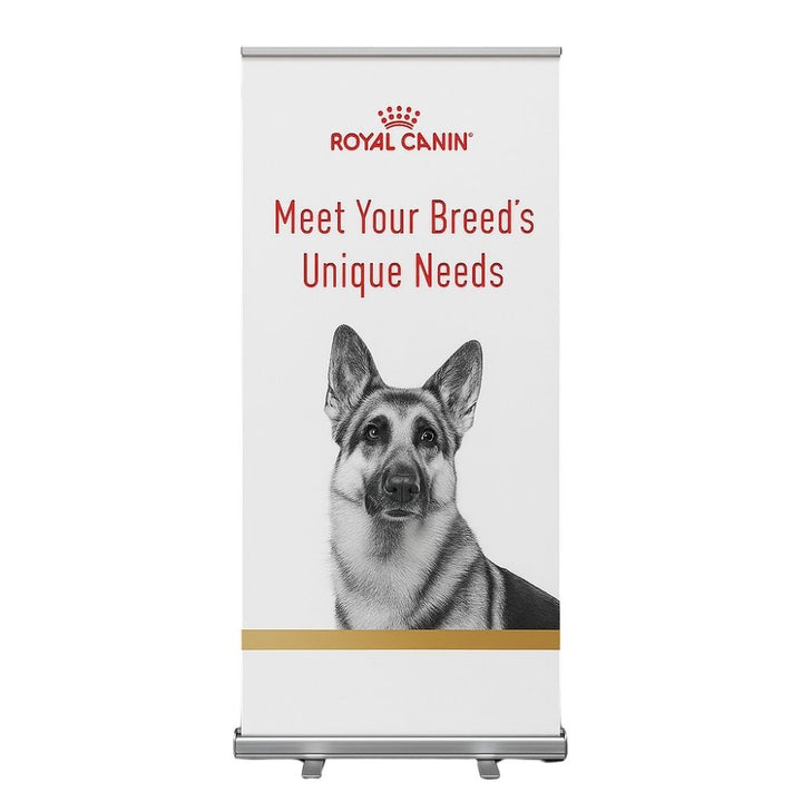 Promotional Royal Canin roller banner designed for pet nutrition events, with a detailed German Shepherd image and the tagline “Meet Your Breed’s Unique Needs,” suitable for trade shows or clinics.

