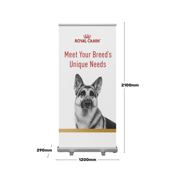 Royal Canin branded roller banner on a white background with a German Shepherd illustration and the text “Meet Your Breed’s Unique Needs,” shown with product dimensions for indoor use.

