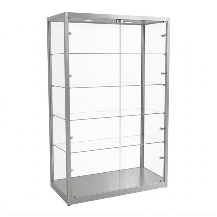 Silver frame shown bare, four glass shelves on side rails and spotlights recessed above, a single centre lock securing both doors for reception display.
