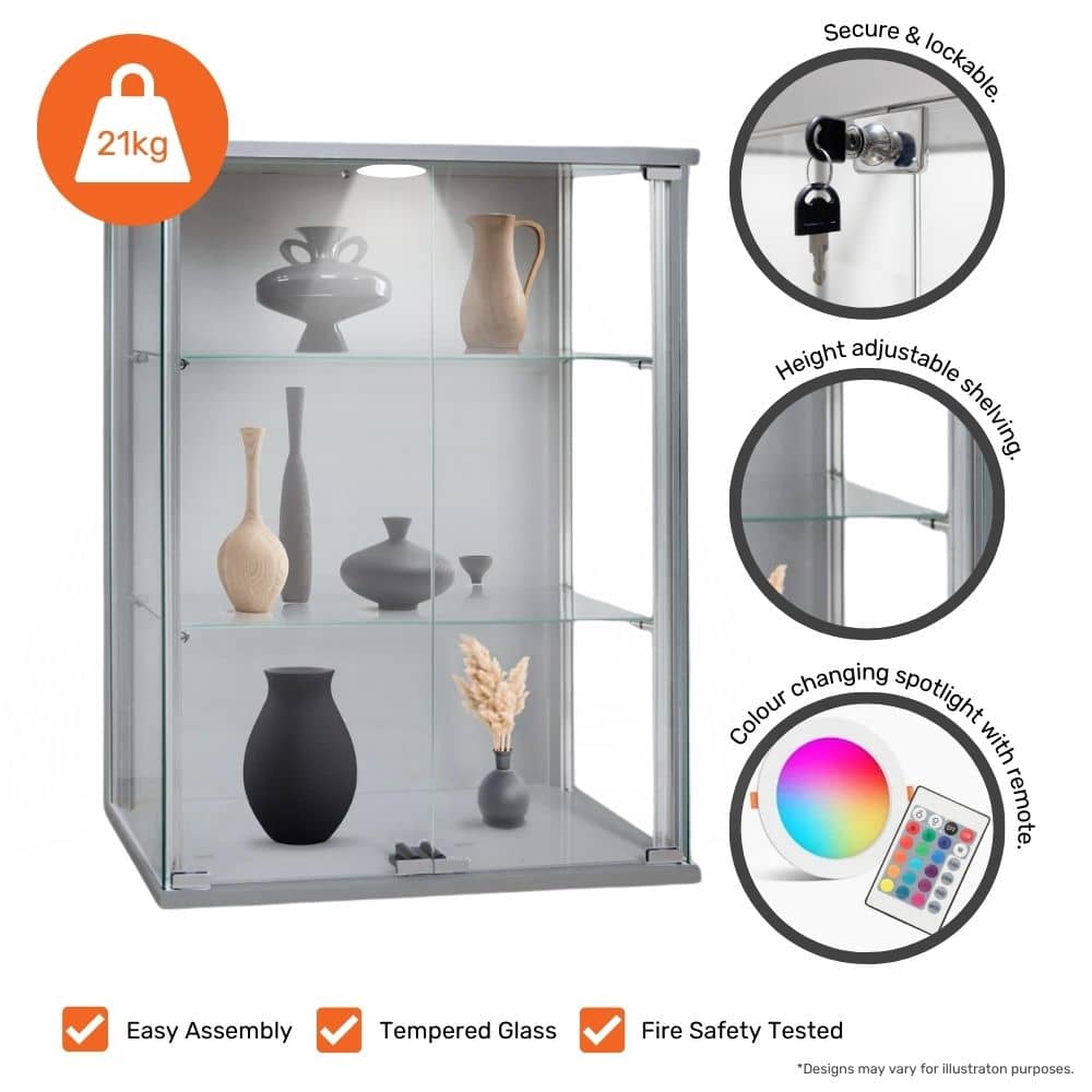 Compact and stylish silver aluminium glass display cabinet with double doors, two adjustable shelves, and a wall-mounted design, 600mm width.
