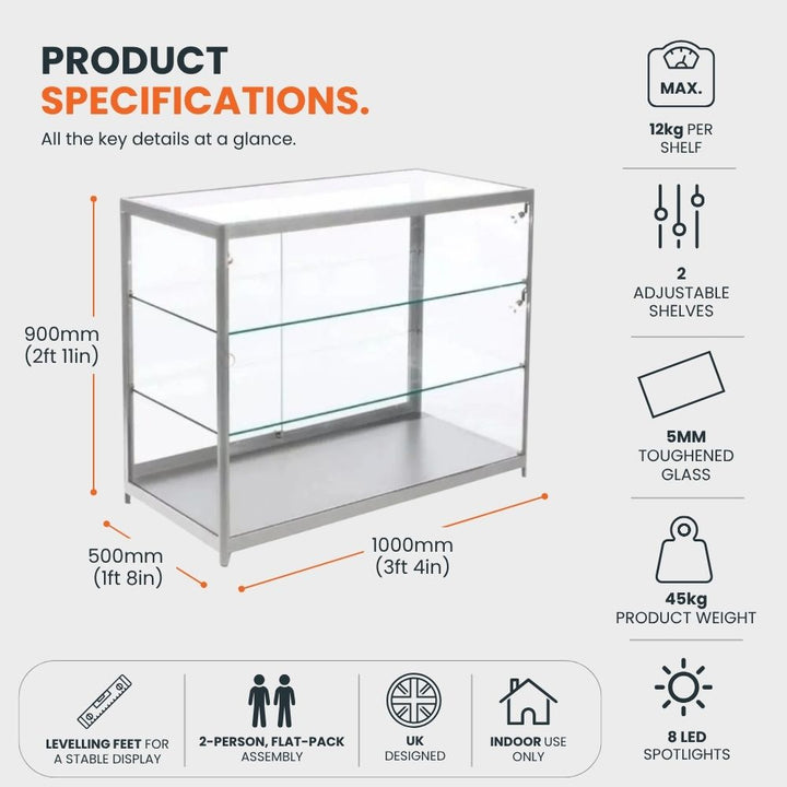 Silver aluminium glass counter display cabinet measuring 1000 x 500 x 900mm, with two adjustable 5mm toughened glass shelves, 12kg shelf capacity, eight LED spotlights and levelling feet.