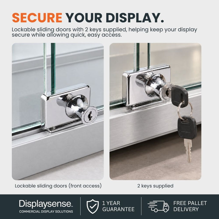 Close-up of a silver glass counter display cabinet showing lockable sliding doors and two supplied keys for secure front access.