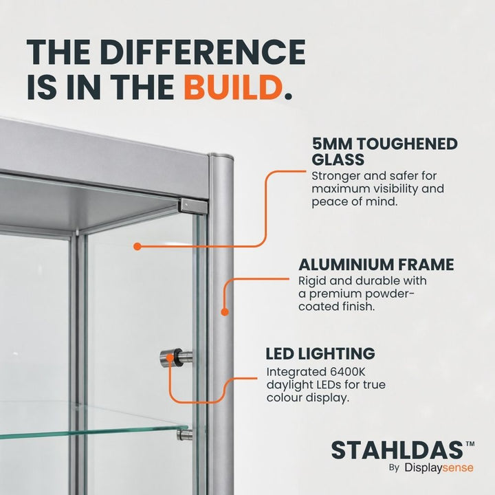Close-up of a silver Stahldas glass display cabinet showing the aluminium frame, 5mm toughened glass and integrated LED lighting.