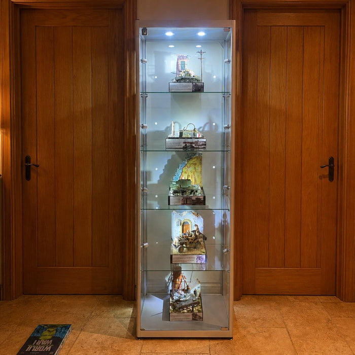 Tall illuminated display cabinet featuring military vehicle models and scale dioramas