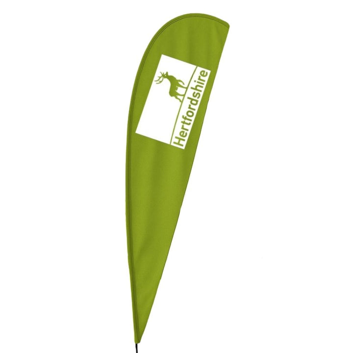 Single-sided 4.4m teardrop flag on a glass fibre pole with custom print for outdoor retail forecourts, car dealerships and public sector outdoor displays.
