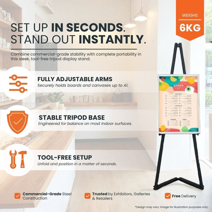 black-tripod-display-stand-with-adjustable-arms-and-stable-base-for-posters-or-canvases-in-modern-interior
