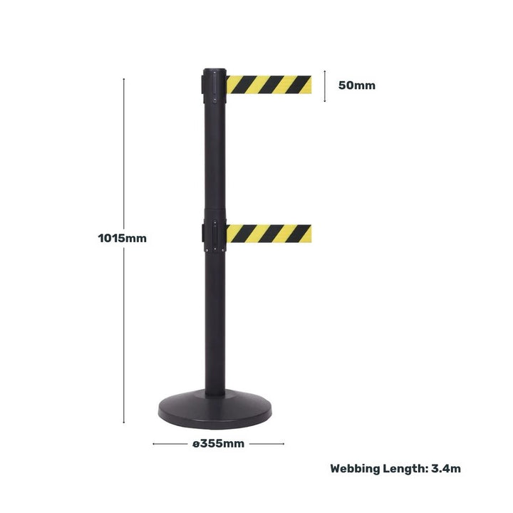 Black retractable twin barrier measuring 1015mm high on a 355mm diameter base, with 50mm wide chevron belts extending to 3.4m webbing length.

