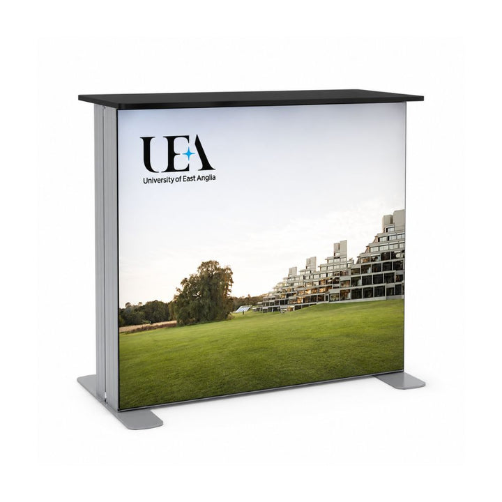Portable exhibition counter branded with University of East Anglia graphics and campus landscape photography for educational events.