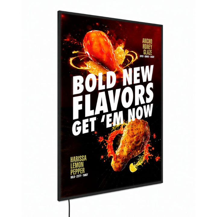Wall-mounted A1 LED lightbox advertising display featuring a vibrant illuminated food promotion graphic within a slim black frame.