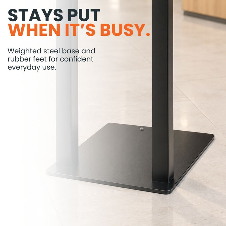 Close-up of the black weighted steel base and upright on the A4 freestanding poster display stand, designed for stable indoor positioning.