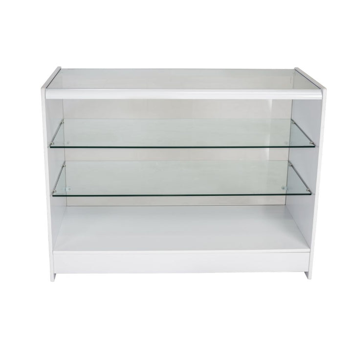 Front view of a white glass retail display counter with two clear glass shelves, open customer-facing showcase space and a clean wooden frame, designed for merchandising gifts, accessories, jewellery, cosmetics and premium products in shops, boutiques and commercial retail interiors.