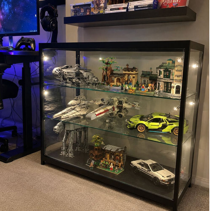 Wide black glass cabinet displaying a LEGO Star Wars collection