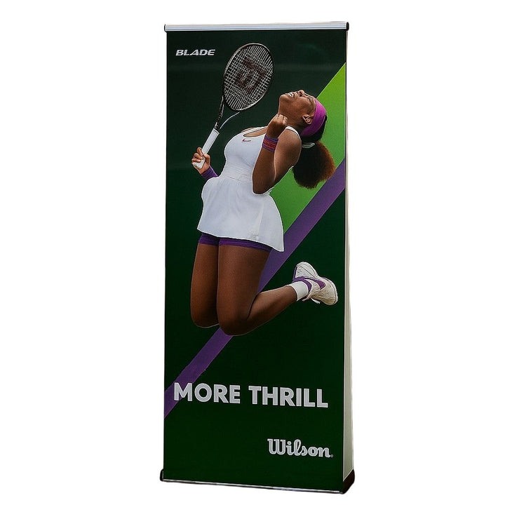 Blade tennis promotional banner by Wilson showing a dynamic tennis player image with the words "More Thrill", used in retail merchandising.

