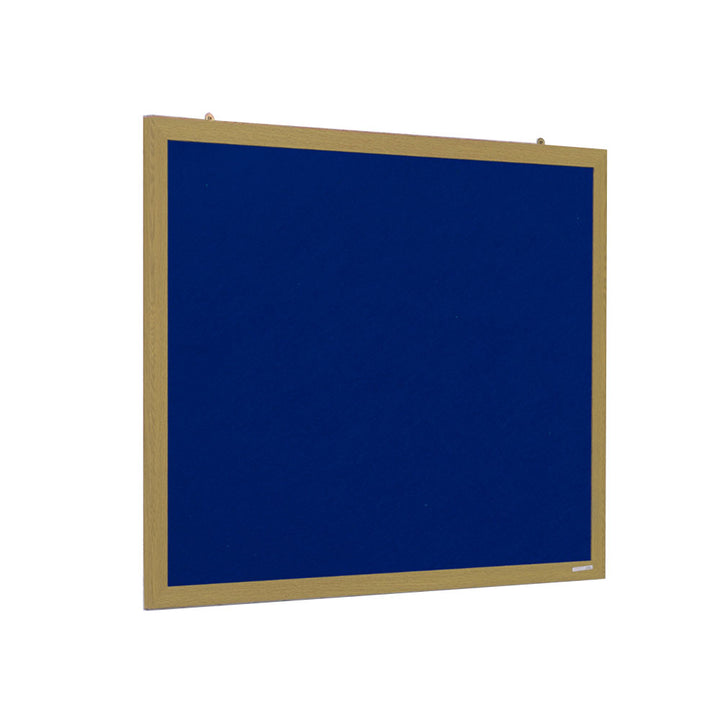 Angled view of the recycled blue felt face in a light wood-effect frame, hanging brackets fitted ready for an office or training room wall.



