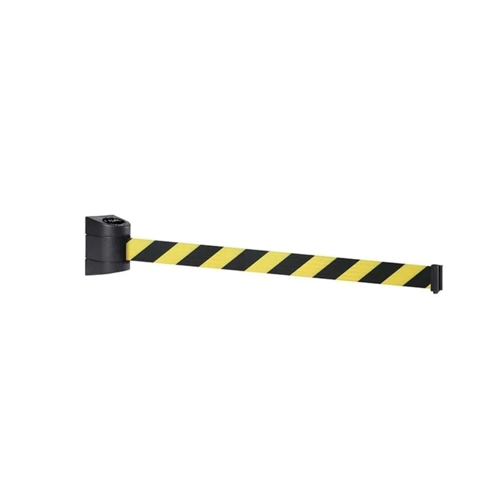 Close-up of a yellow and black wall-mounted retractable barrier with extended striped webbing on a white background.
